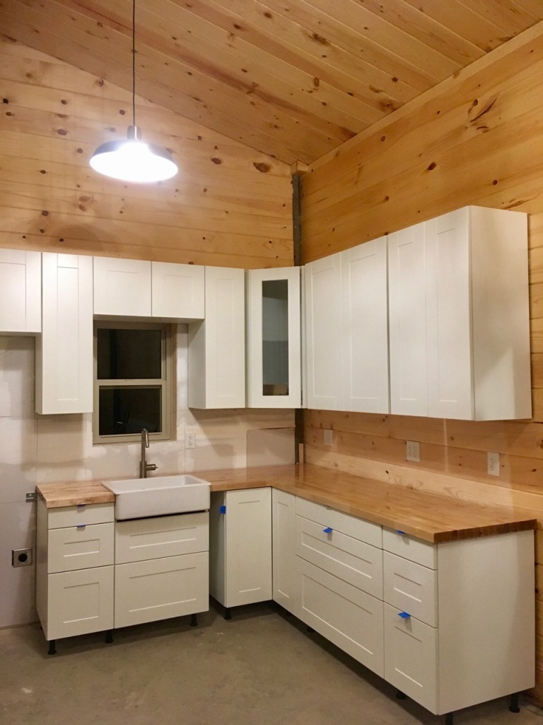 new construction IKEA kitchen installation in mountain cabin